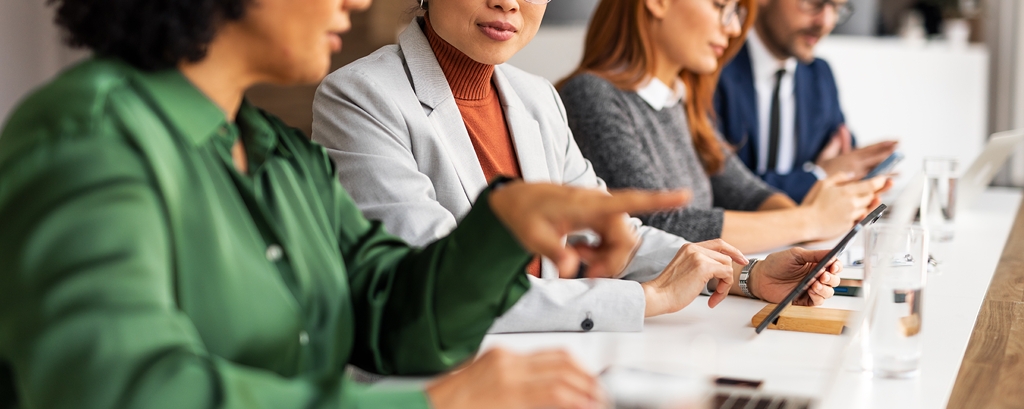 4 people discussing during a meeting at a table